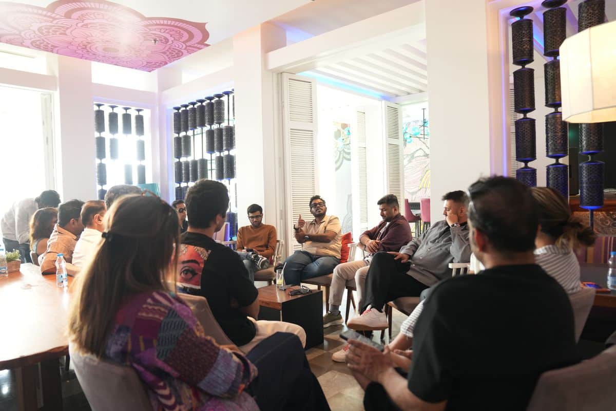 D2CX Fellows in a closed-door breakout circle at Basecamp 1.0