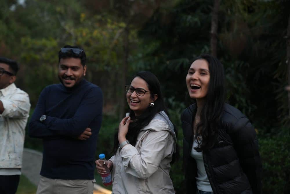Fellows sharing a light moment outdoors at Basecamp 1.0